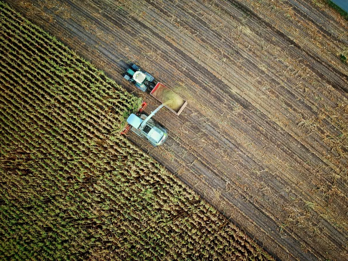 Agricultural machinery on a rural worksite, representing contractor equipment support and additional capacity for rural service providers.